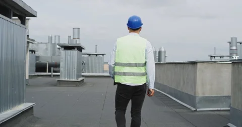 Funny good looking architect on the rooftop of construction site dancing and Video stock 116410186