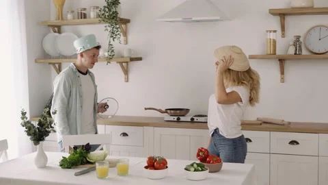 Funny Good looking Couple Having Great Fun in the Kitchen, Cooking Healthy Meal Stock-Footage 136586415
