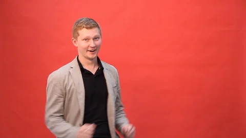 Funny guy dancing on red background Stock Footage 103187750