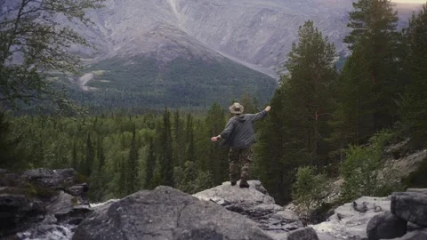 Funny guy dancing on top of a mountain. Achieving the goal, winning Stock Footage 165645508