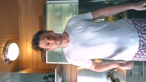 Funny guy freak funny dancing in his kitchen at home Stock Footage 139098035