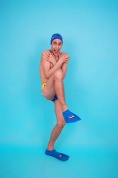 Funny guy with an inflatable ring in the pool. Stock Photos
