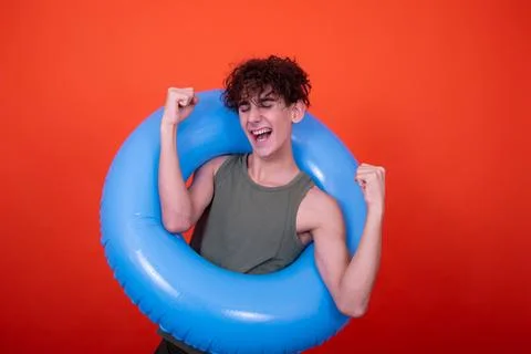 Funny guy with an inflatable ring. Vacation and holidays. Foto stock