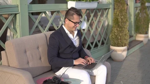 Funny guy quickly writes on laptop Stock Footage 87246999