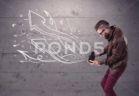 Funny guy taking photos with retro camera Stock Photos