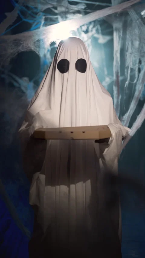 Funny halloween ghost with pizza box advertising pizzeria and fast food in dark Stock Footage 313735812