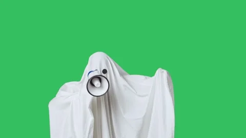 Funny halloween ghost in white sheet talks advertises in loud speaker, isolated Stock Footage 285749883