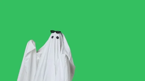 Funny halloween ghost in white sheet wears black glasses dancing coolly Stock Footage 285750269