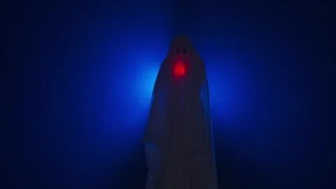 Funny halloween ghost in white sheet silhouette shines under sheet with red Stock Footage 285751569