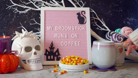 Funny Halloween table set up with My Broomstick Runs on Coffee letter board. Stock Footage 116152617