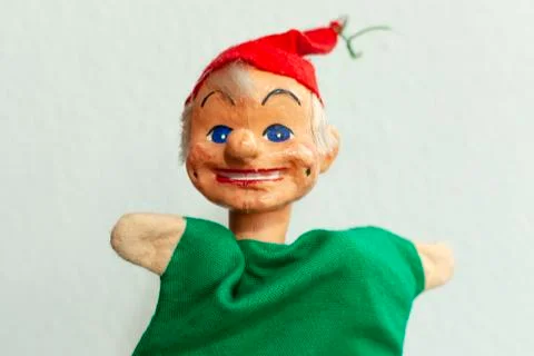 Funny handmade Kasperle puppet on bright background Foto stock