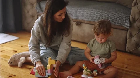 Funny happy cute boy playing and laughing having fun with young asian mother Stock Footage 240697688