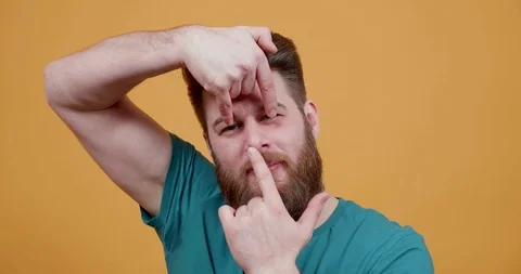 Funny hipster with beard making silly and funny faces Stockbeeldmateriaal 104283138