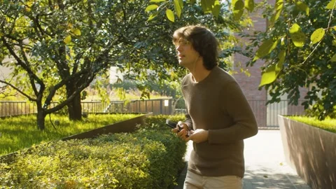 Funny hipster dancing in a park Video stock 142445310