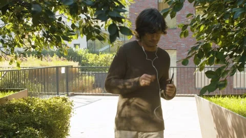 Funny hipster dancing in a park Stock Footage 142446242