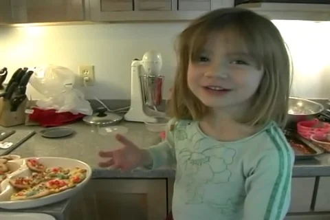 Funny home video of a cute 2-year-old girl making Christmas cookies. Stock Footage 107281145