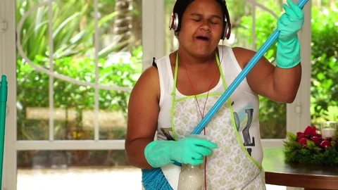 Funny Housekeeper Dancing and Having Fun With Broom Stock Footage 83391207
