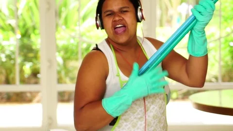 Funny Housekeeper Dancing and Having Fun With Broom Stock Footage 83391453