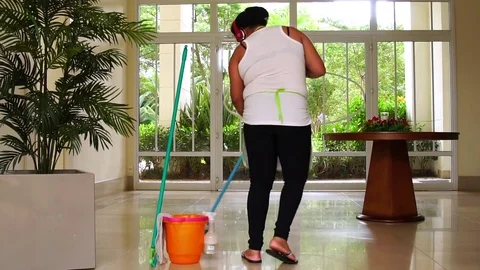 Funny Housekeeper Dancing and Having Fun With Broom Stock Footage 83391871