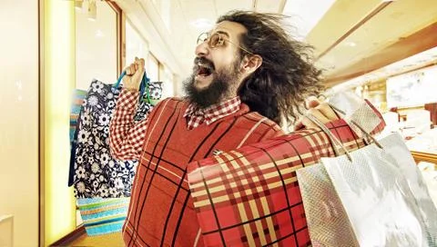 Funny image of geek guy during a sale madness Фото