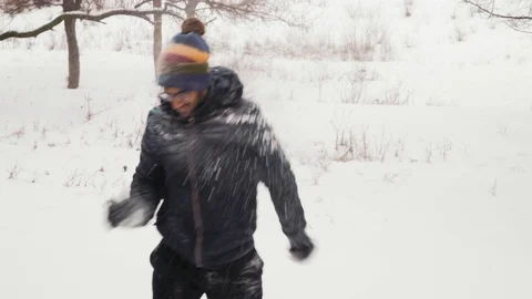 Funny Indian Guy Throws Snowballs At A Girl Carefully Stock Footage 101588021