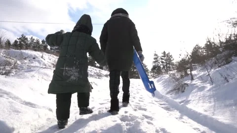 Funny kid in winter it's cold in the snow Stock Footage 154427133