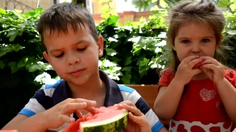 Funny kids eating watermelon. Child, Healthy Eating. 库存影片 151151653