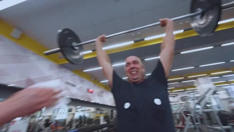 Funny lifting of the barbell on the chest with ejection Stock Footage 247549908