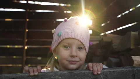 Funny, little, blonde girl in a pink hat. Stock Footage