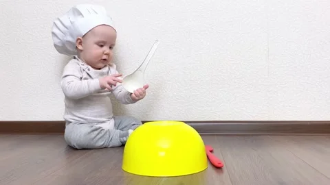 Funny little boy playing in chef cook, Stock Footage 173360451