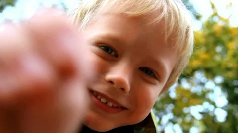 funny little kid. smiling boy looking at... | Stock Video | Pond5