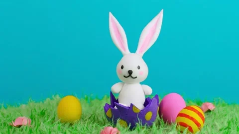 Funny little rabbit among Easter eggs in grass Stock Footage 149119486