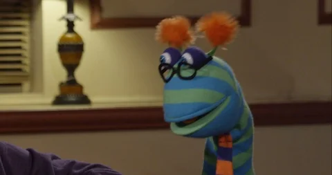 Funny Looking Puppet Wearing Glasses Tal... | Stock Video | Pond5