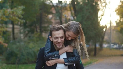 Funny lovely couple having fun outdoors laughing joyful girl girlfriend nature Stock Footage 102744482