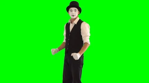 Funny male mime in white and black clothes imitating dancing. One actor Stock-Footage