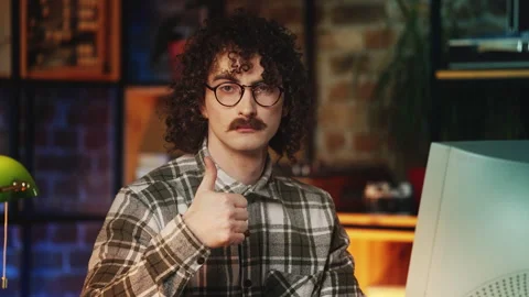 Funny male programmer showing thumbs up while working on computer, 90s lifestyle Stock Footage 315455744