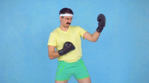 Funny man athletic boxer with a mustache ,posing in the camera Stock Footage 107149342