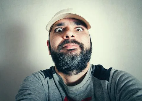 Funny man with the beard making expressions Stock Photos