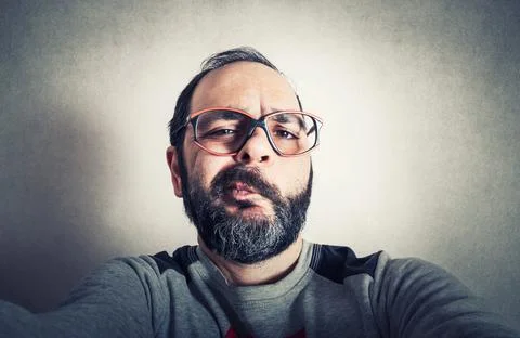 Funny man with the beard making expressions Stock Photos