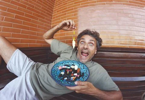 Funny man with candy assortment Stock-Fotos