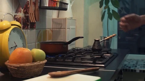 Funny man cooking meal dancing in front of stove at kitchen Stock Footage 83090238