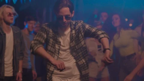 Funny man dance with group of friends together enjoying party music at night Stock Footage 114927397