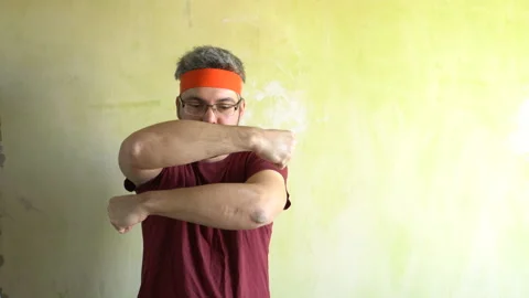 Funny man doing exercises with his hands 4K Video stock 126125894