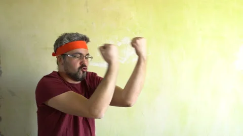 Funny man doing martial arts 4K Stock Footage 126125880