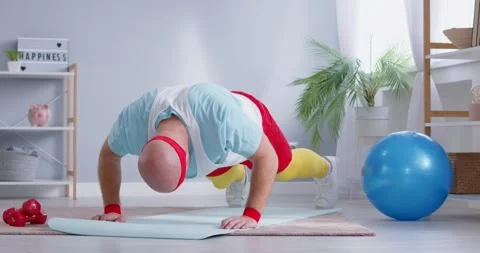 Funny Man Exercising At Home And Attempting Push Ups Stock Footage 281574013