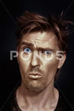 Funny man with golden make-up Stock Photos