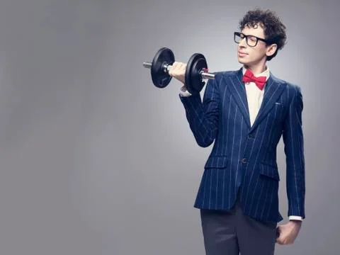 Funny man lifting weights Stock Photos