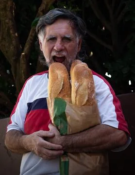 Funny man making funny faces to eat Stock Photos