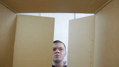 Funny man opens a parcel box with different versions of emotions 스톡 동영상 99338856