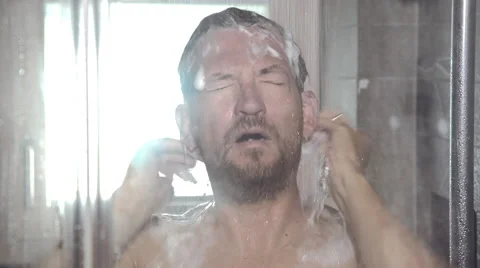 Funny man singing  in shower Stock Footage 55425099